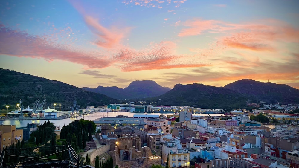 a view of a city with mountains in the background