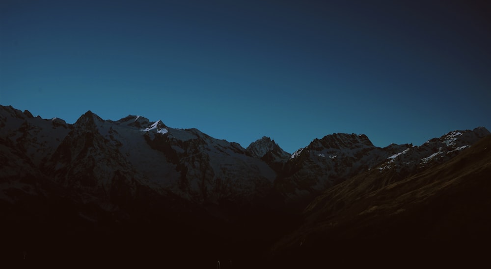 a view of the top of a mountain at night