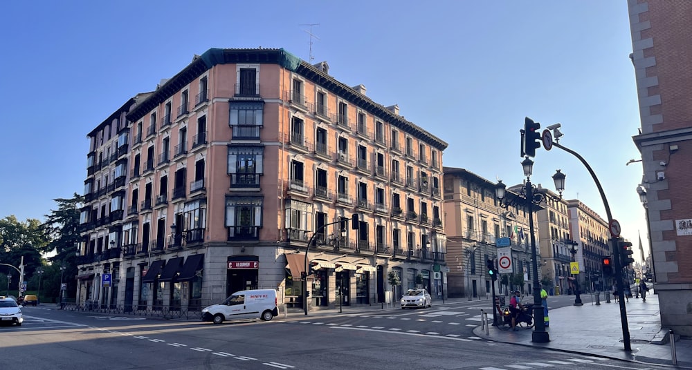 a street corner with a building and a traffic light