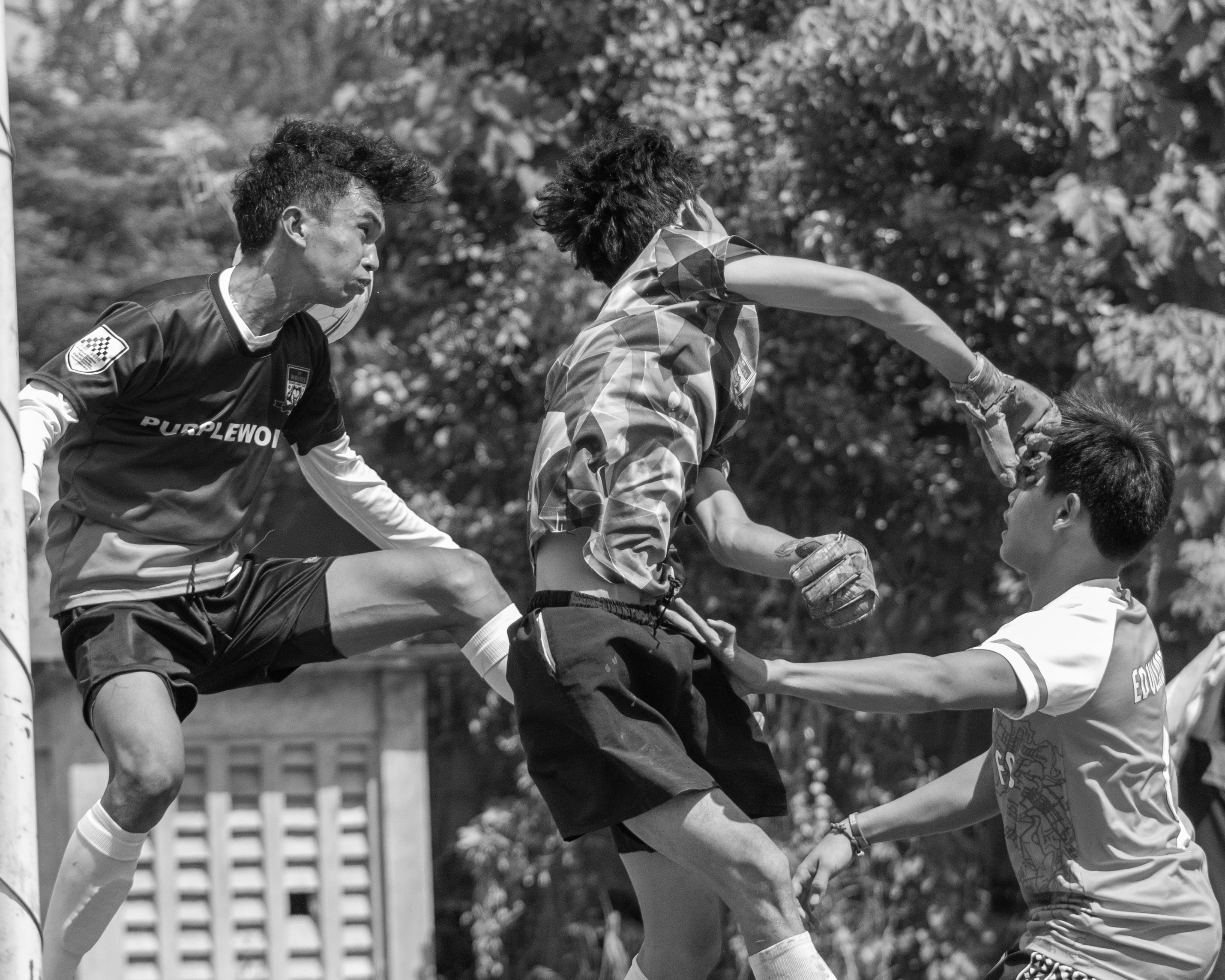 a group of young men playing a game of soccer