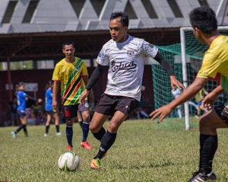 a group of young men playing a game of soccer