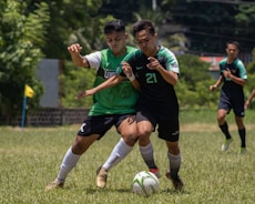 a group of young men playing a game of soccer