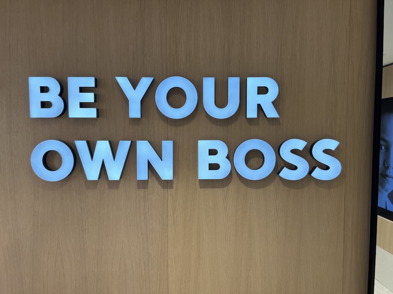 a sign that says be your own boss
