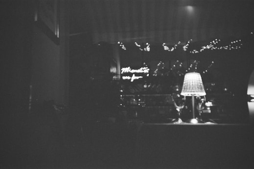 A cozy, intimate setting with soft lighting highlighting delicate lingerie and sensual accessories.