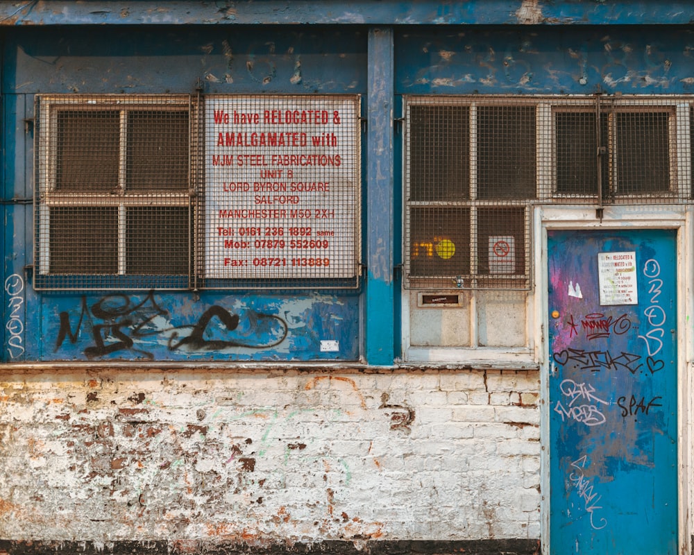 an old building with graffiti on the side of it