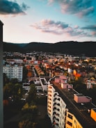 A vibrant aerial view of Pune city skyline at sunset highlighting urban development.