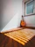 A warm, inviting therapy room with musical instruments arranged neatly, sunlight streaming through a window.