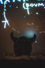 Dark atmospheric scene with shadowy figures and mysterious glowing symbols.