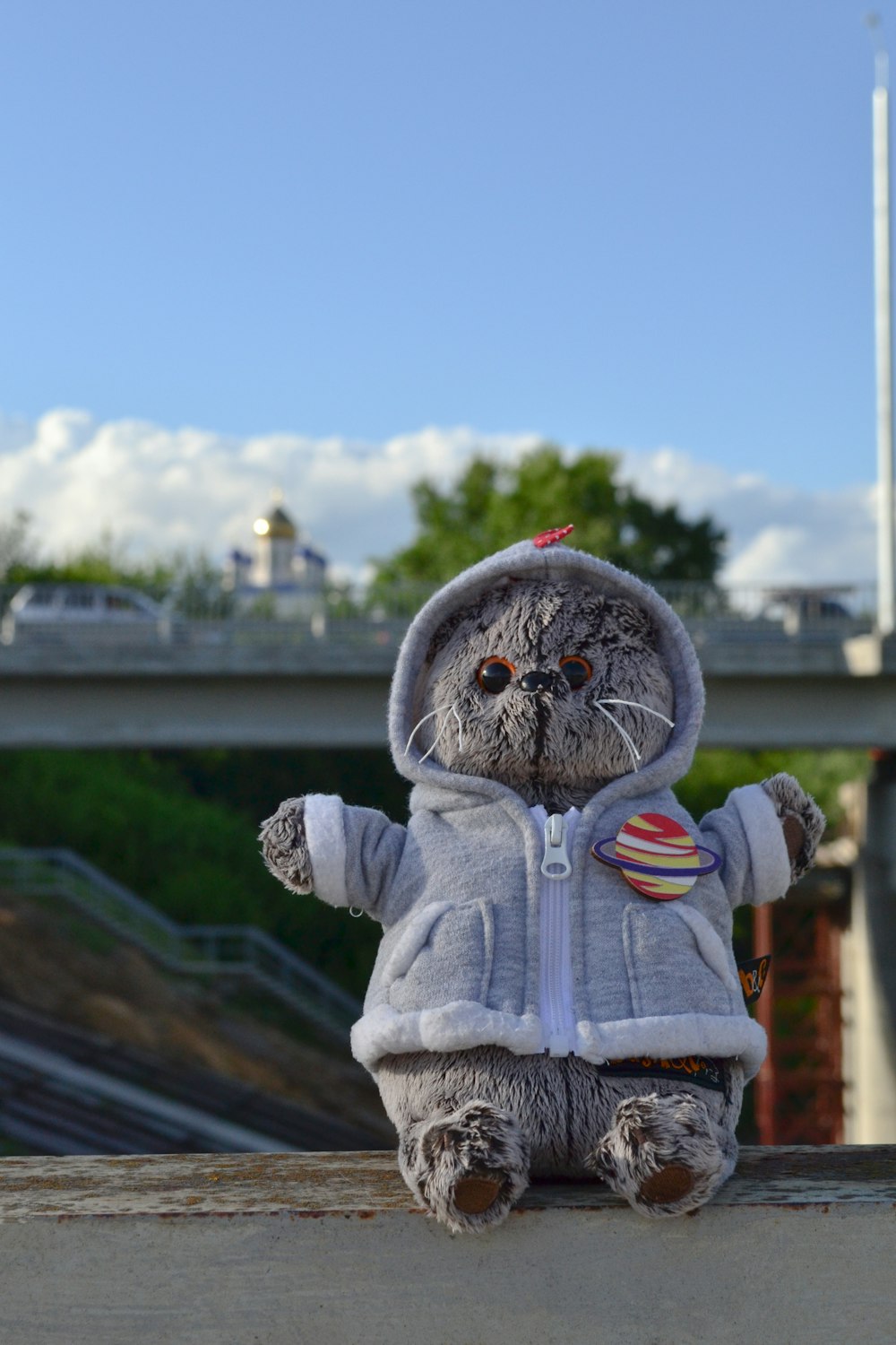 a stuffed animal is sitting on a ledge