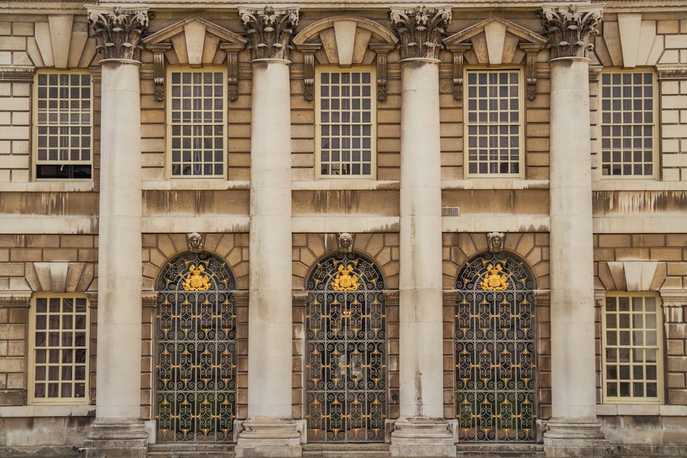 a large building with four windows and a clock on the front of it