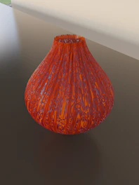 A delicate glass vase with colorful swirls catching the light.