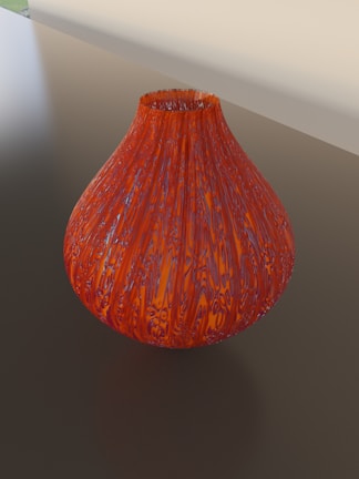 A delicate Victorian-style recycled glass vase with intricate floral etching.