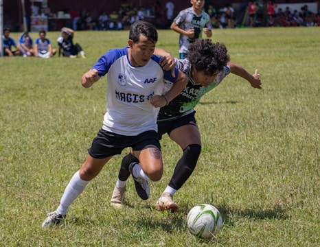 a group of young people playing a game of soccer