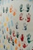 a group of multicolored hand prints on a white wall