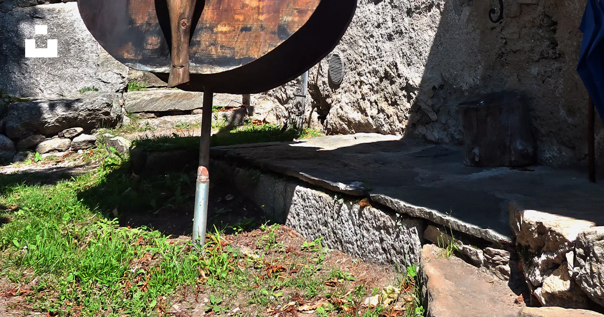 A large metal contraption sitting outside of a building photo – Free So ...
