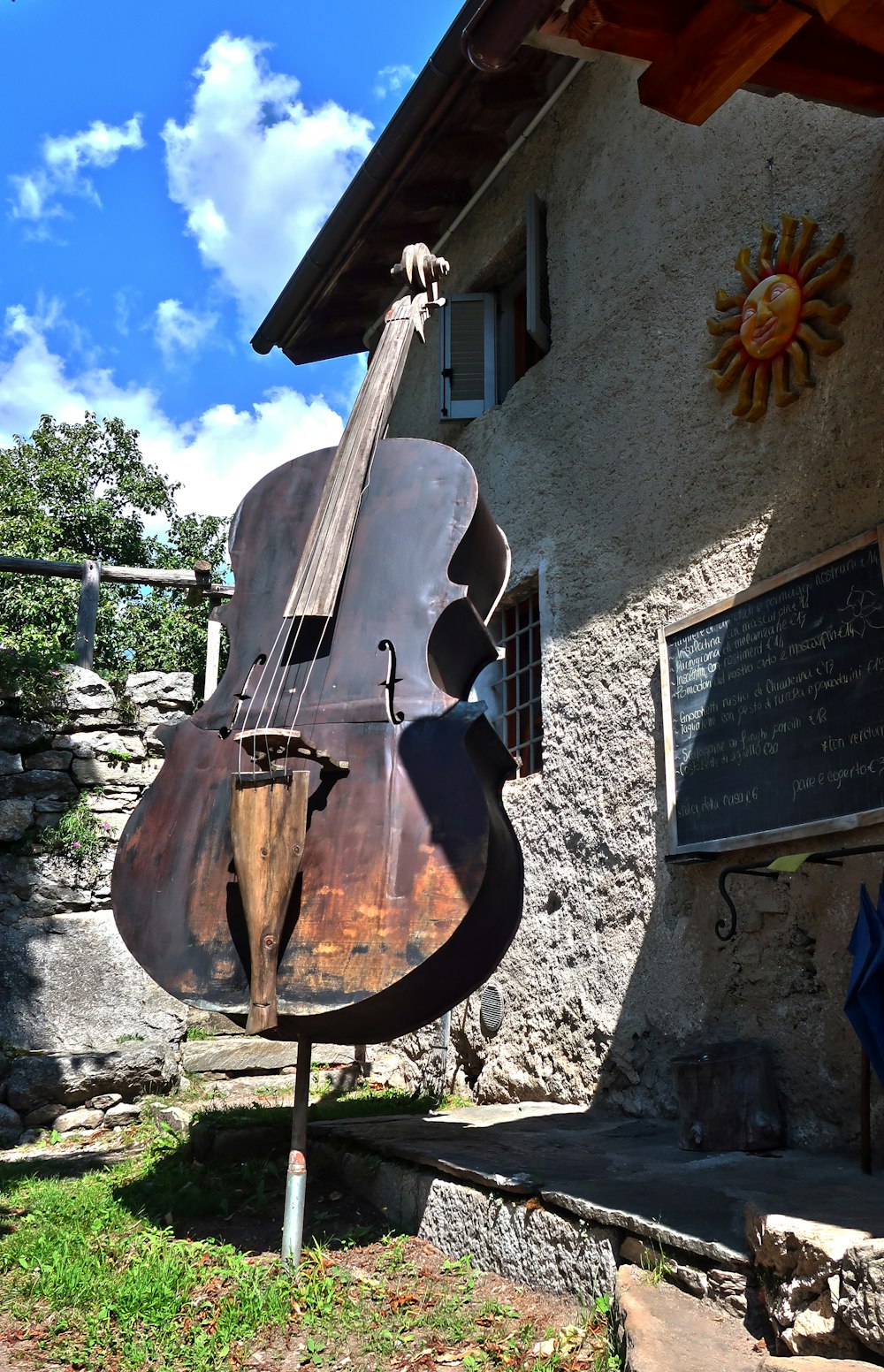 a large metal contraption sitting outside of a building