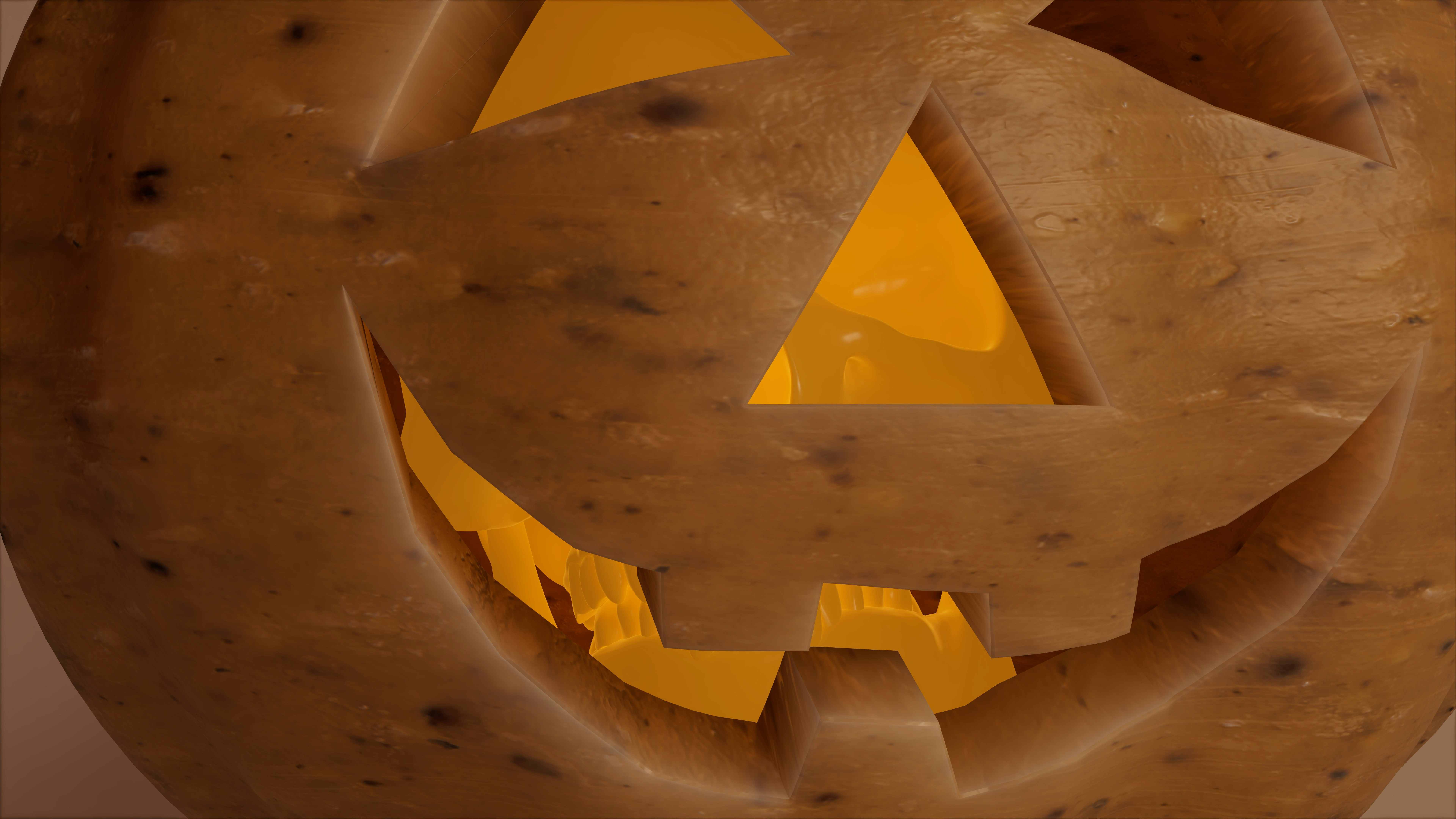 une pomme de terre avec un cric sculpté - o - lanterne dessus