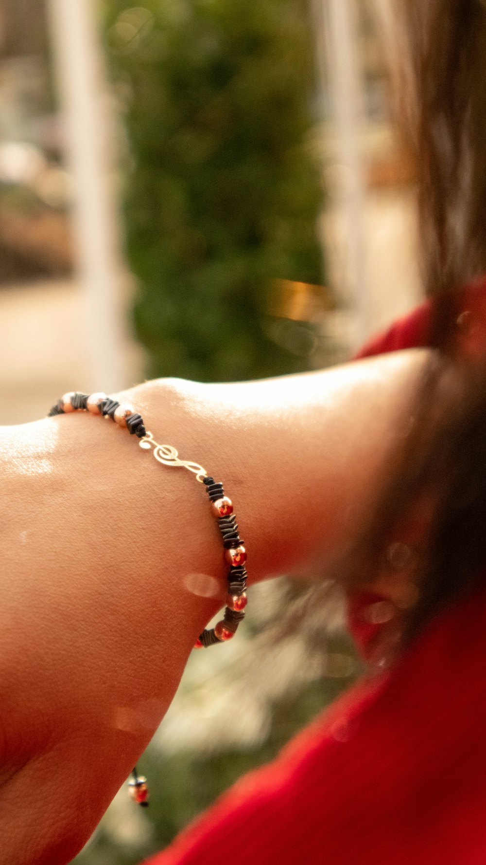 a close up of a person wearing a bracelet