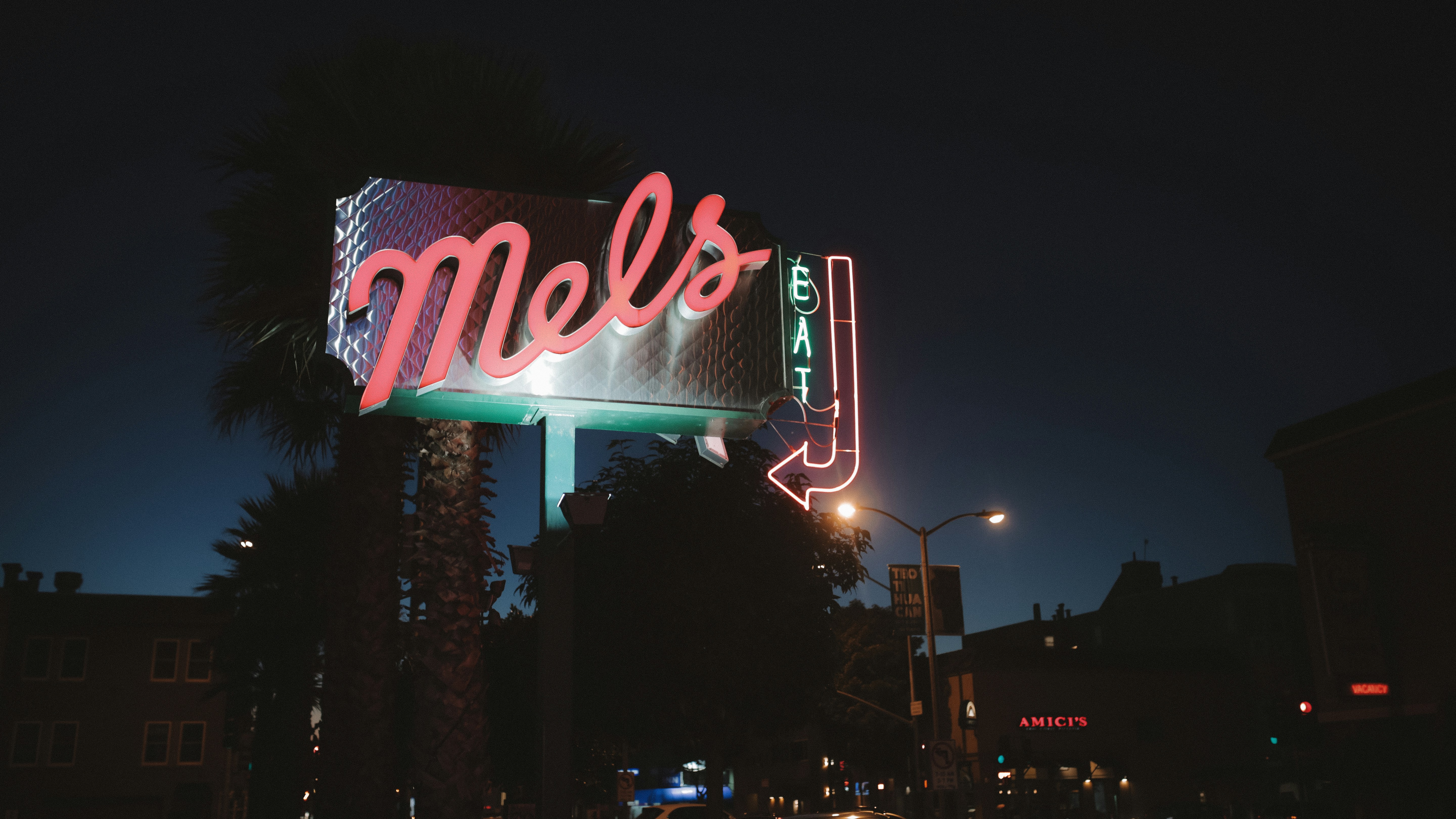 a neon sign that reads mel