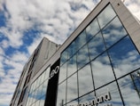 A modern commercial building with large glass windows.