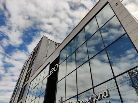 A modern commercial building with large glass windows.