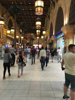 Creative marketing display featuring innovative communication supports in a busy Moroccan shopping center.