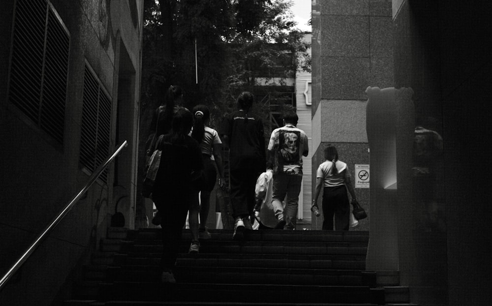 a group of people walking down a flight of stairs