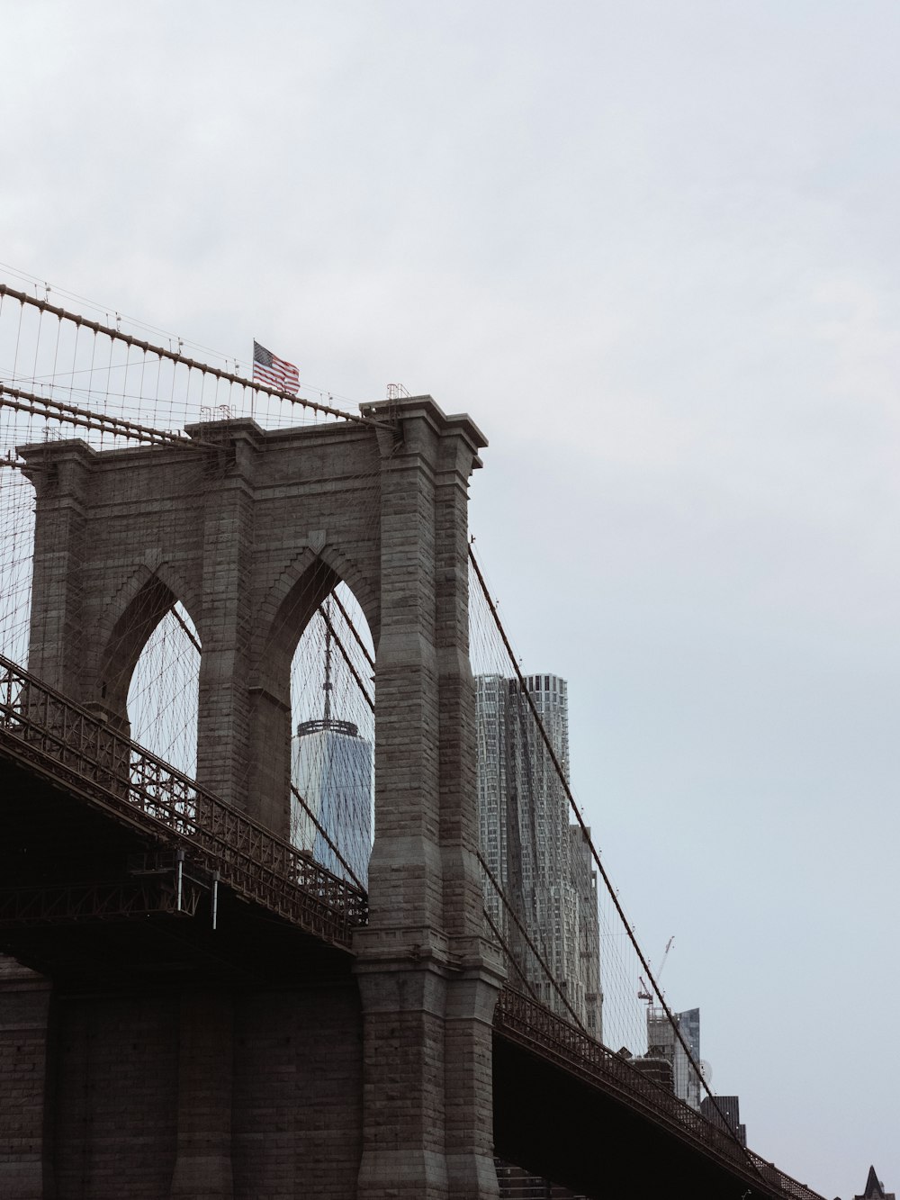 a view of the brooklyn bridge from across the river