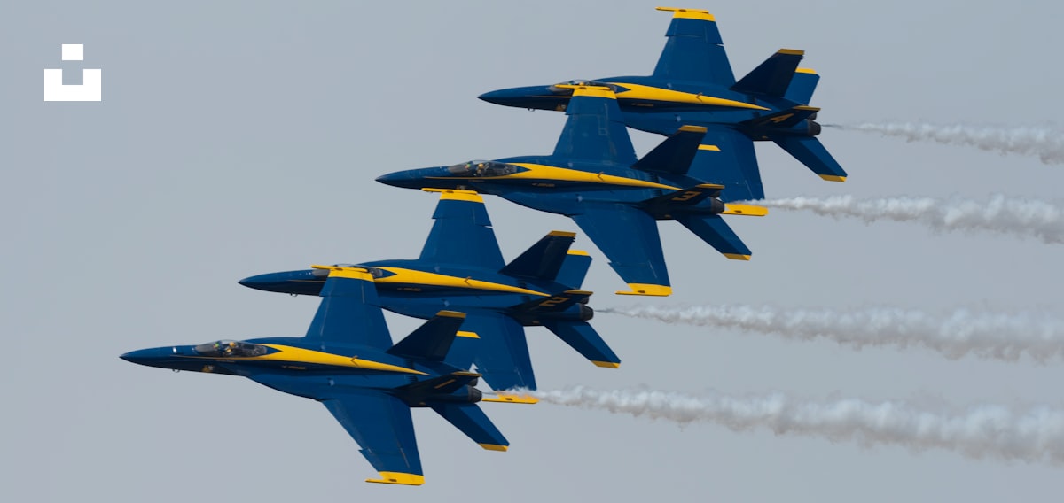 A Group Of Fighter Jets Flying In Formation Photo Free Aircraft Image a-group-of-fighter-jets-flying-in-formation-photo-free-aircraft-image