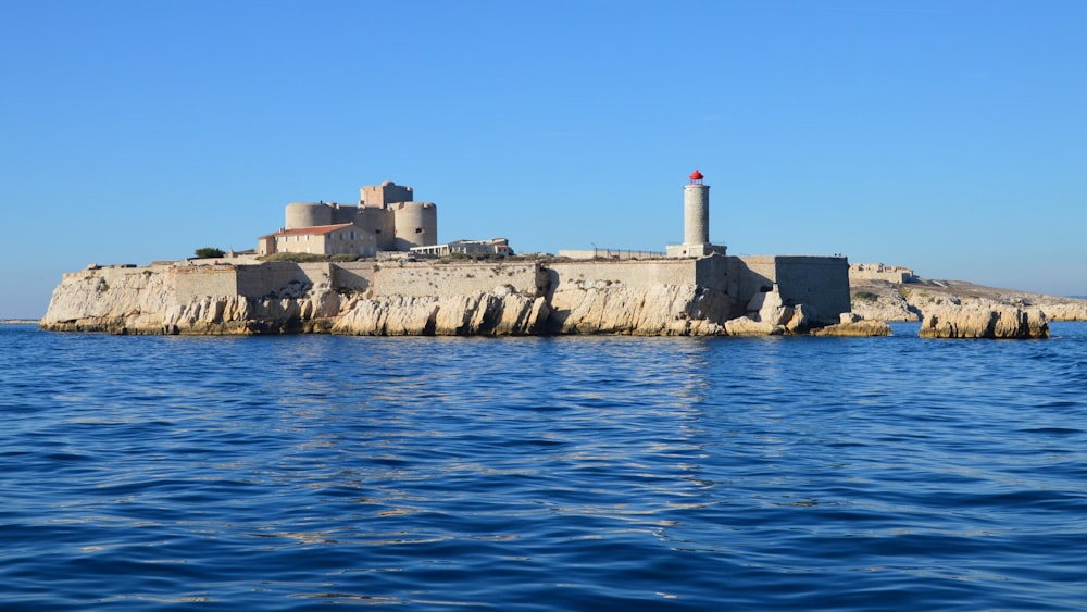 an island with a light house on top of it