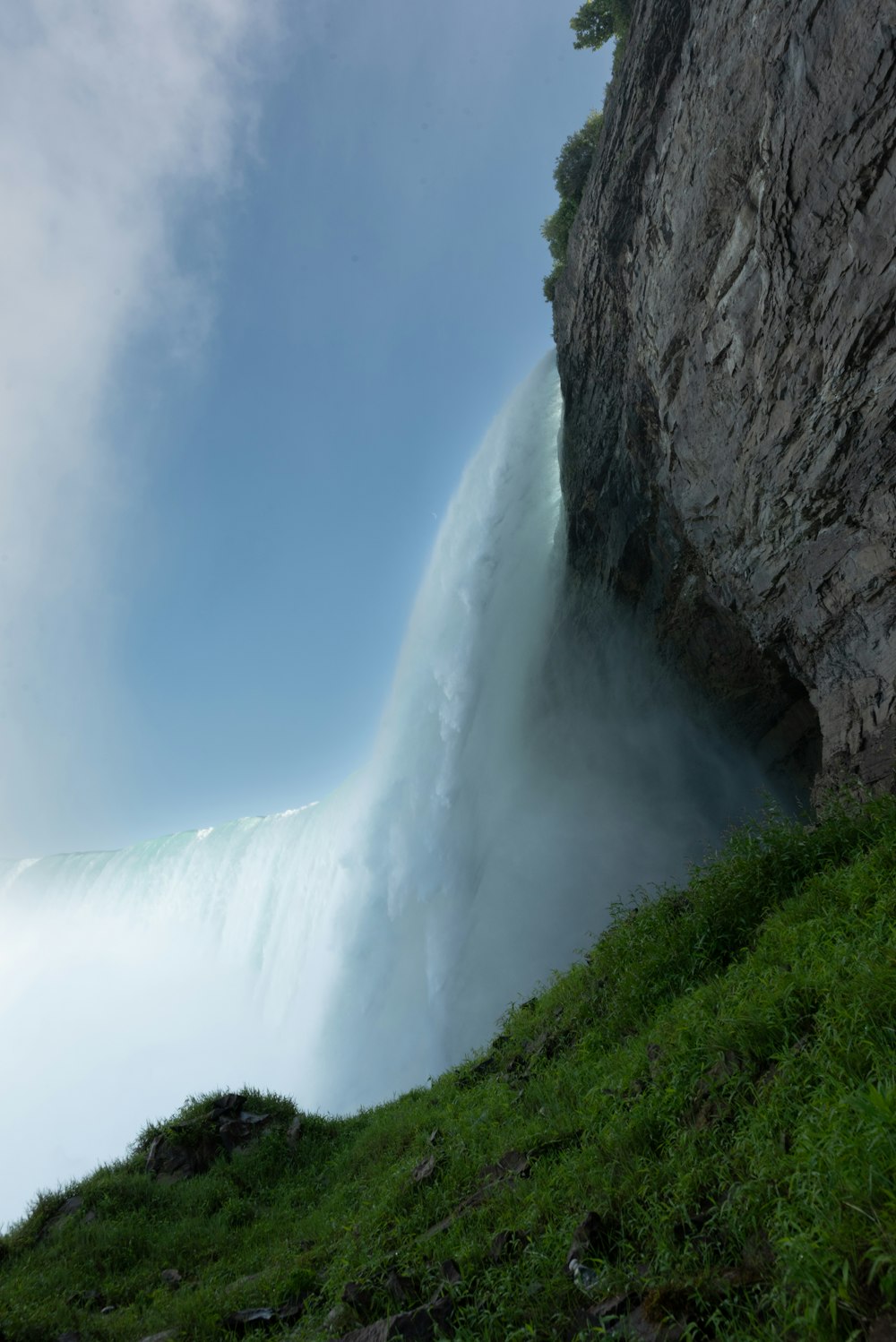 a very tall waterfall with a very steep side