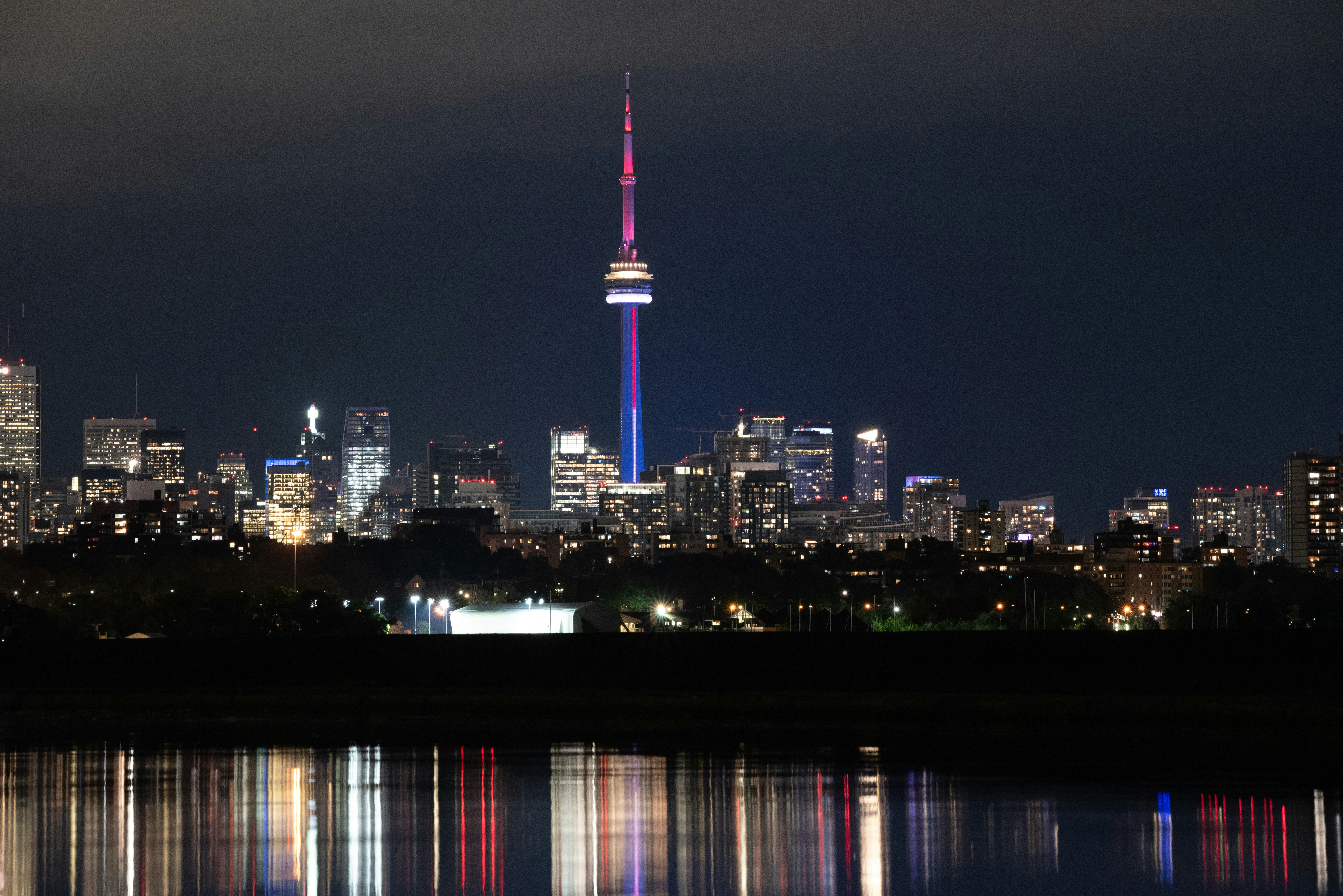 a view of a city at night from across the water