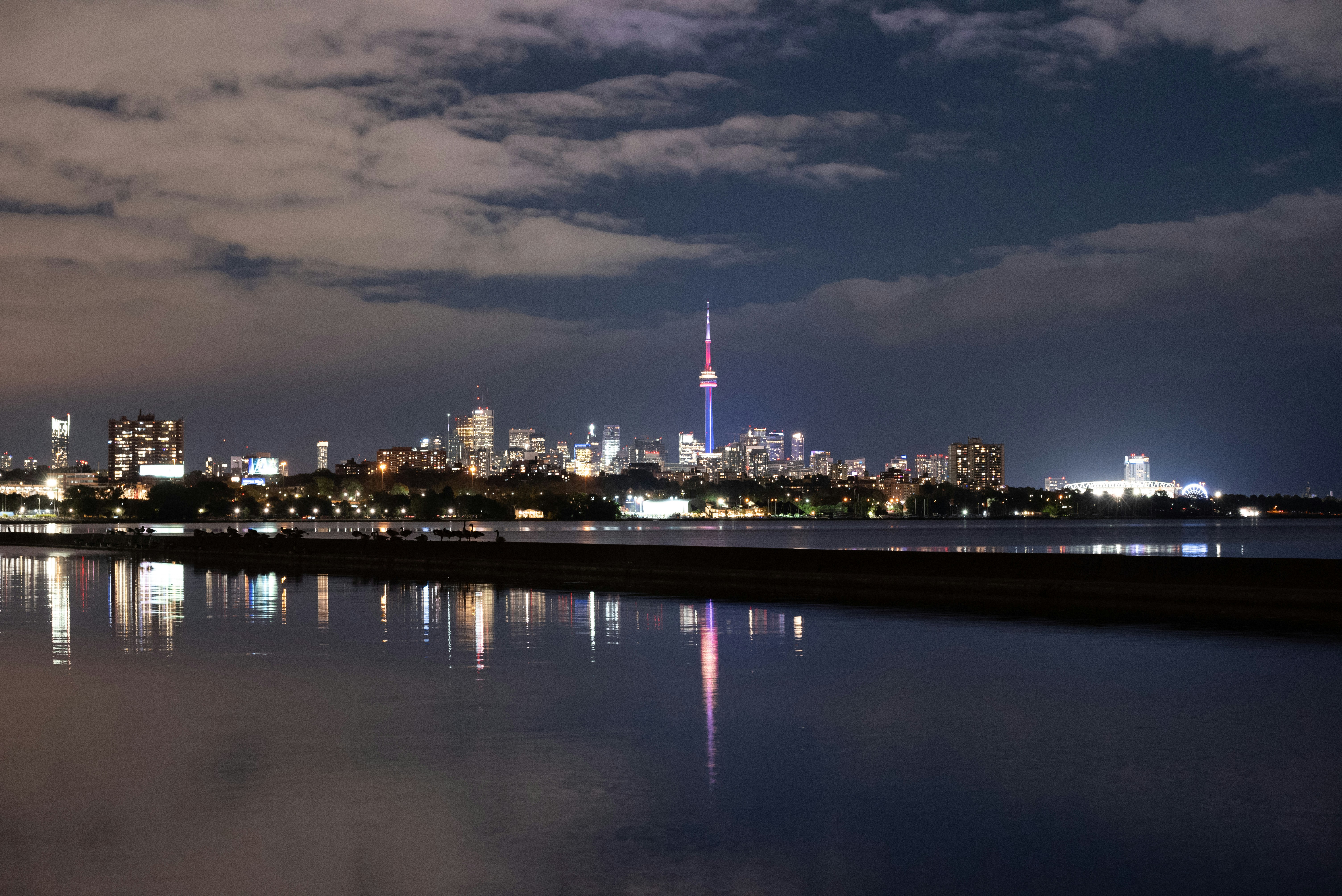 a view of a city at night from across the water
