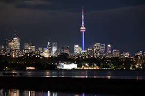A nighttime city skyline with glowing lines symbolizing real-time connections between people worldwide.