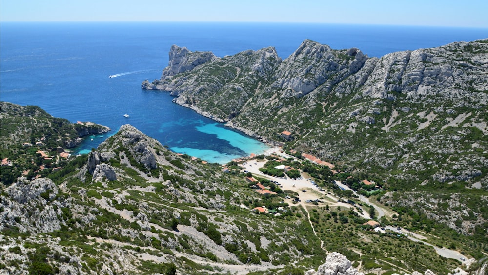 an aerial view of a bay surrounded by mountains