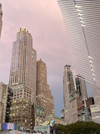 A vibrant Mumbai cityscape with architects and engineers collaborating over blueprints on site.