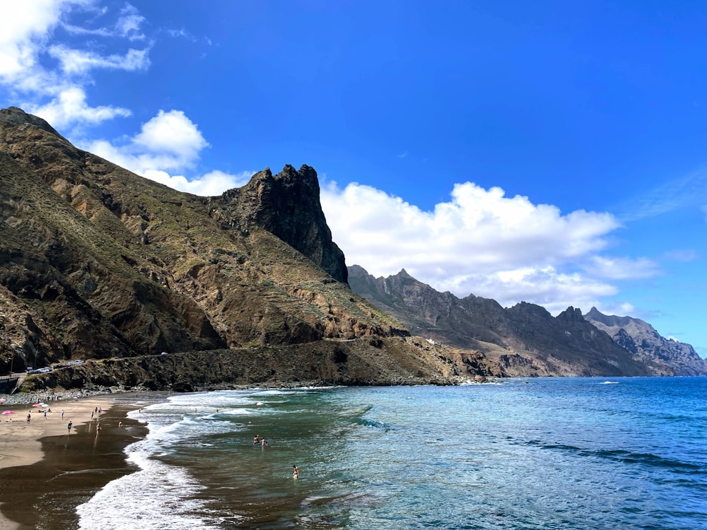 a beach with a mountain in the background