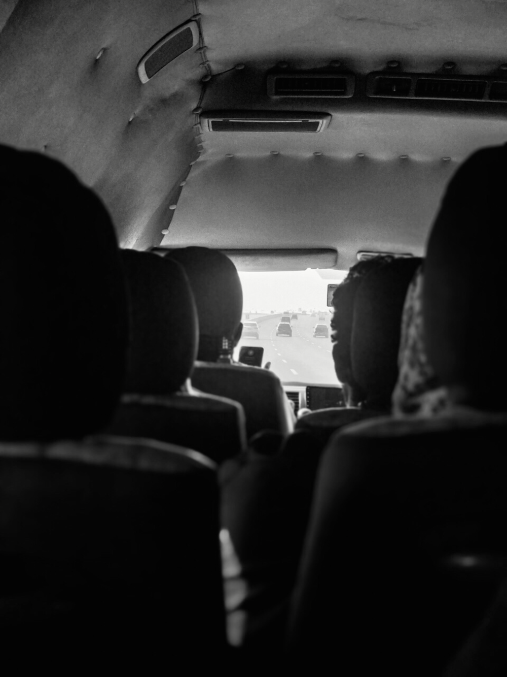 a black and white photo of the inside of a bus