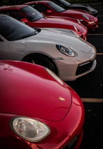 A sleek lineup of cars including luxury sedans, SUVs, and spacious vans ready for booking.