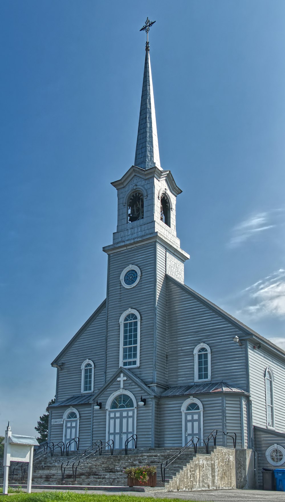 a church with a steeple and a clock tower