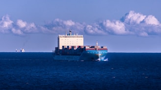 a large cargo ship in the middle of the ocean