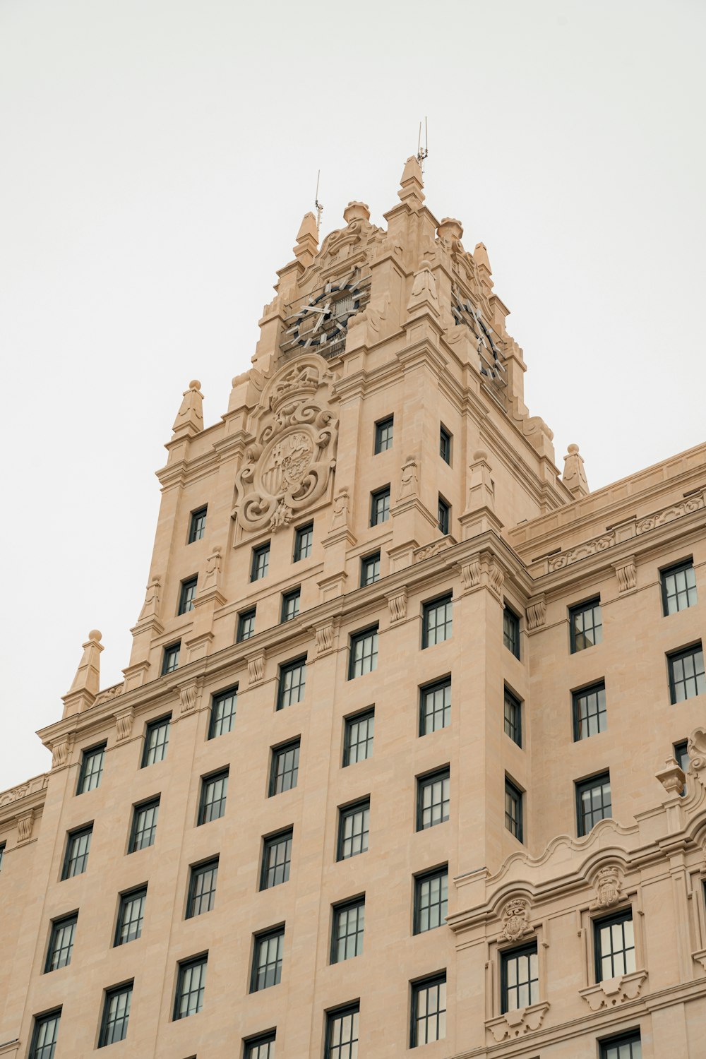 a tall building with a clock on the top of it