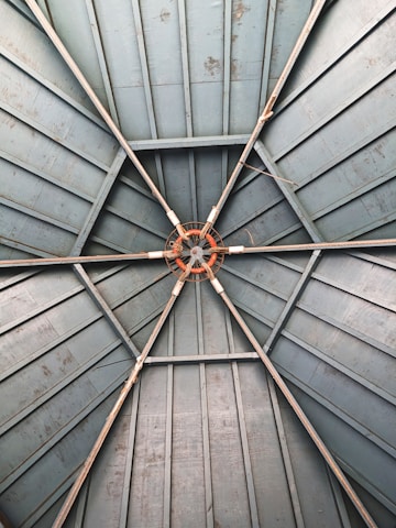 an overhead view of a metal structure with rusted metal bars