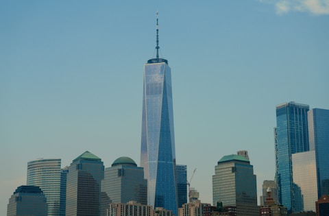 a very tall building towering over a city