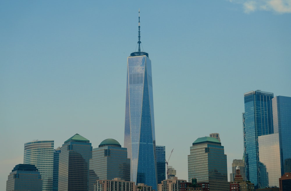 a very tall building towering over a city