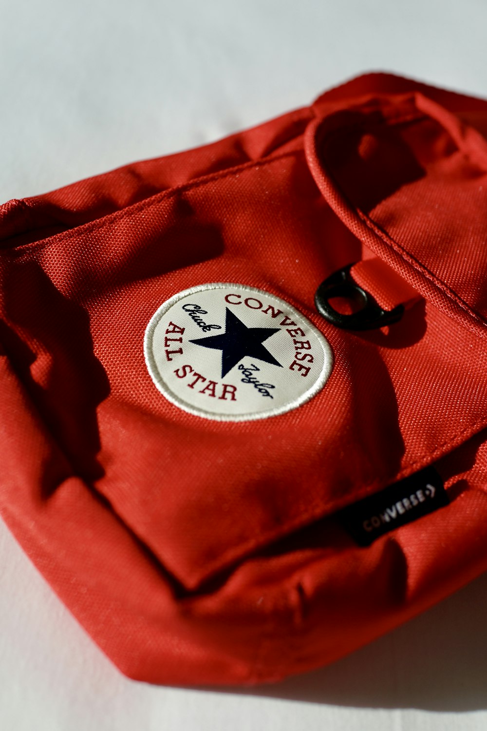 a red bag with a black star on it