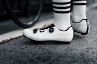 Close-up of a rider’s feet rolling smoothly over rough pavement.