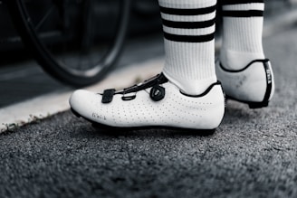 Close-up of a cyclist’s foot on a pedal with pressure sensors.