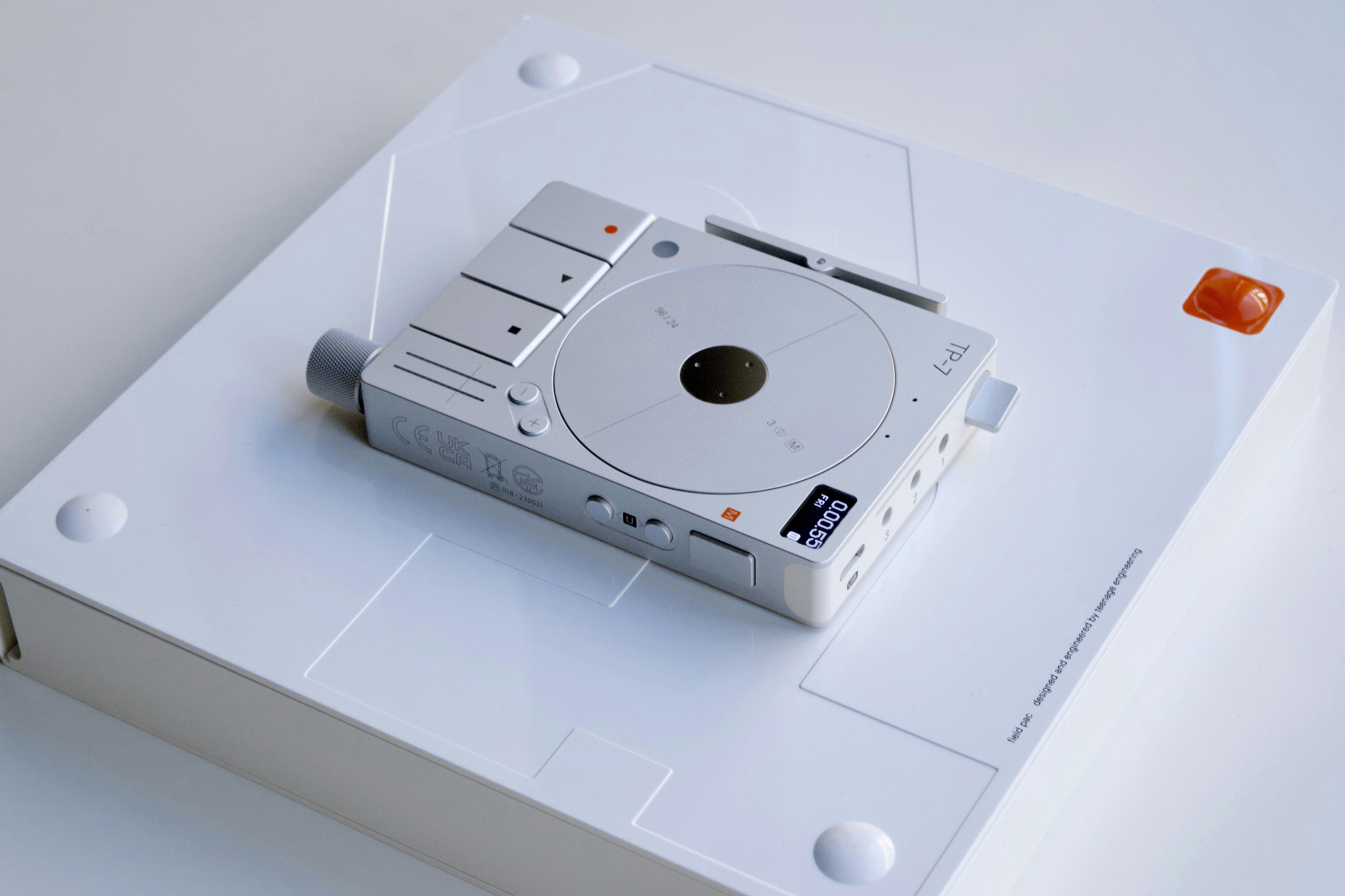 a white electronic device sitting on top of a white table