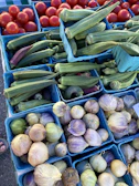 Colorful baskets filled with fresh Mexican fruits and vegetables at a local market.